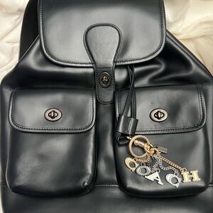 Coach Black Leather Backpack with Gold Accents